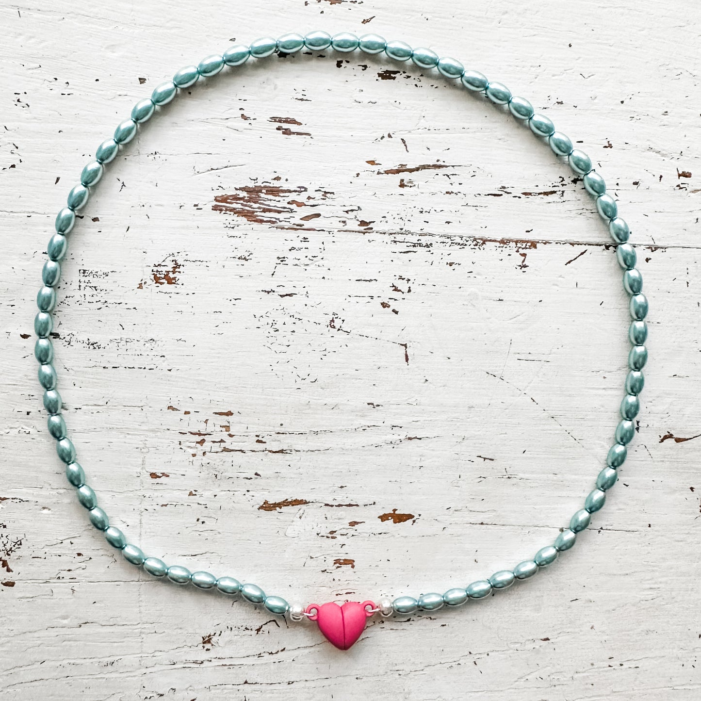 15” shimmery blue green rice beads and pink heart necklace