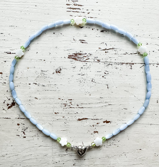 16” Pale blue smooth rice bead with Mother of Pearl flowers and Silver Heart Clasp